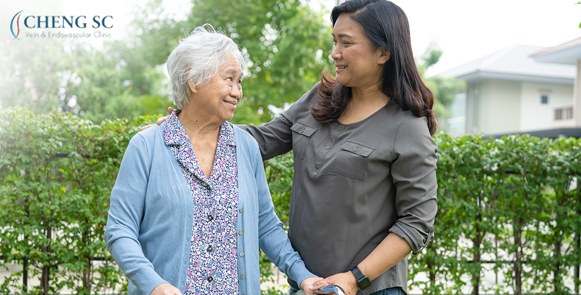 Senior citizen taking a walk with assistance from a helper